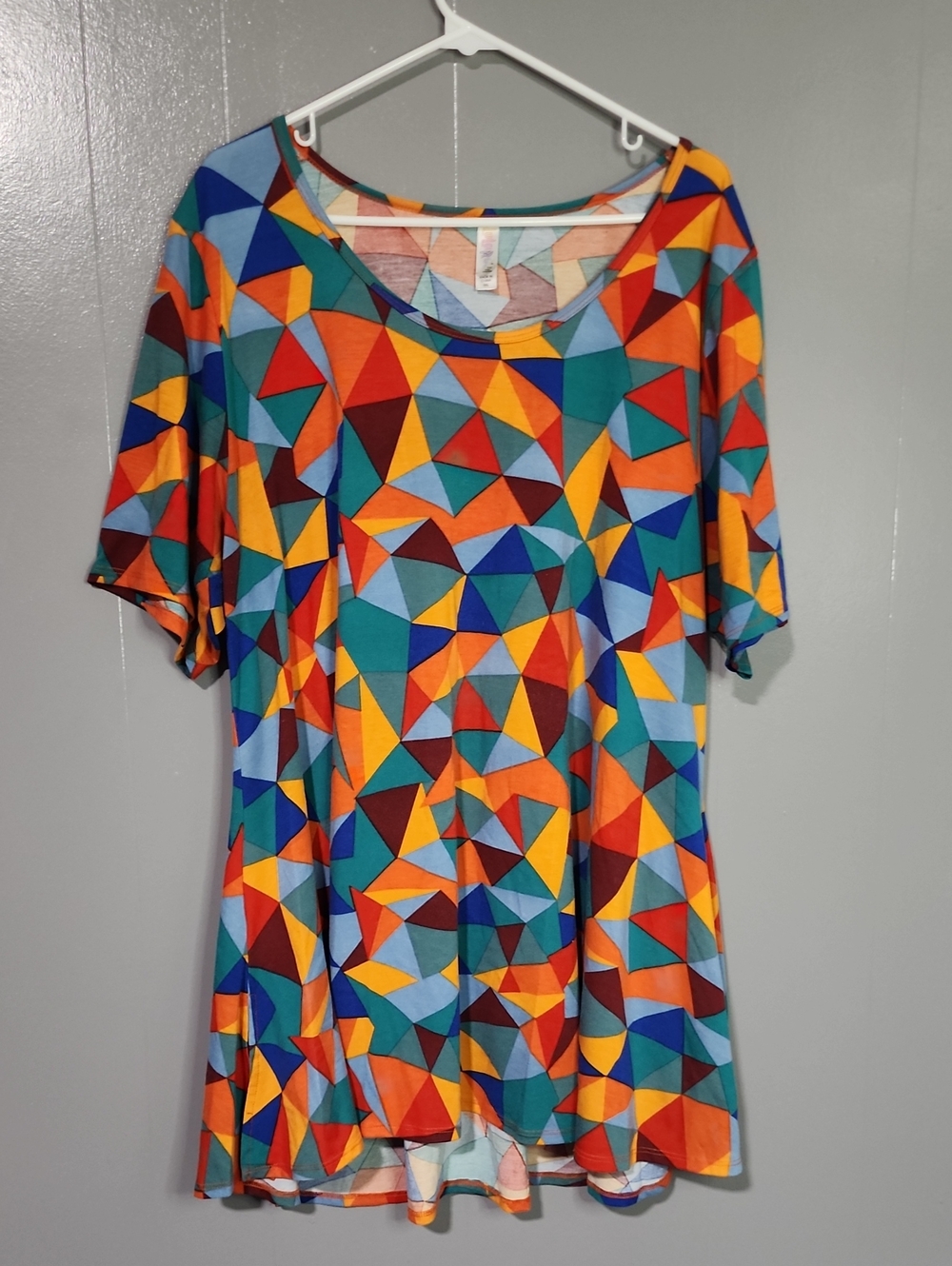LuLaRoe Multicolor Geometric Top in Teal, Orange, Blue, Pink